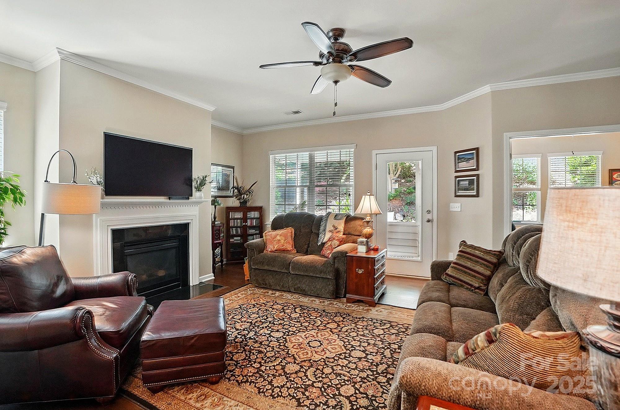 4093 Perth Road Fort Mill, SC 29707 - Photo 11 of 26 a living room with furniture a fireplace and a flat screen tv
