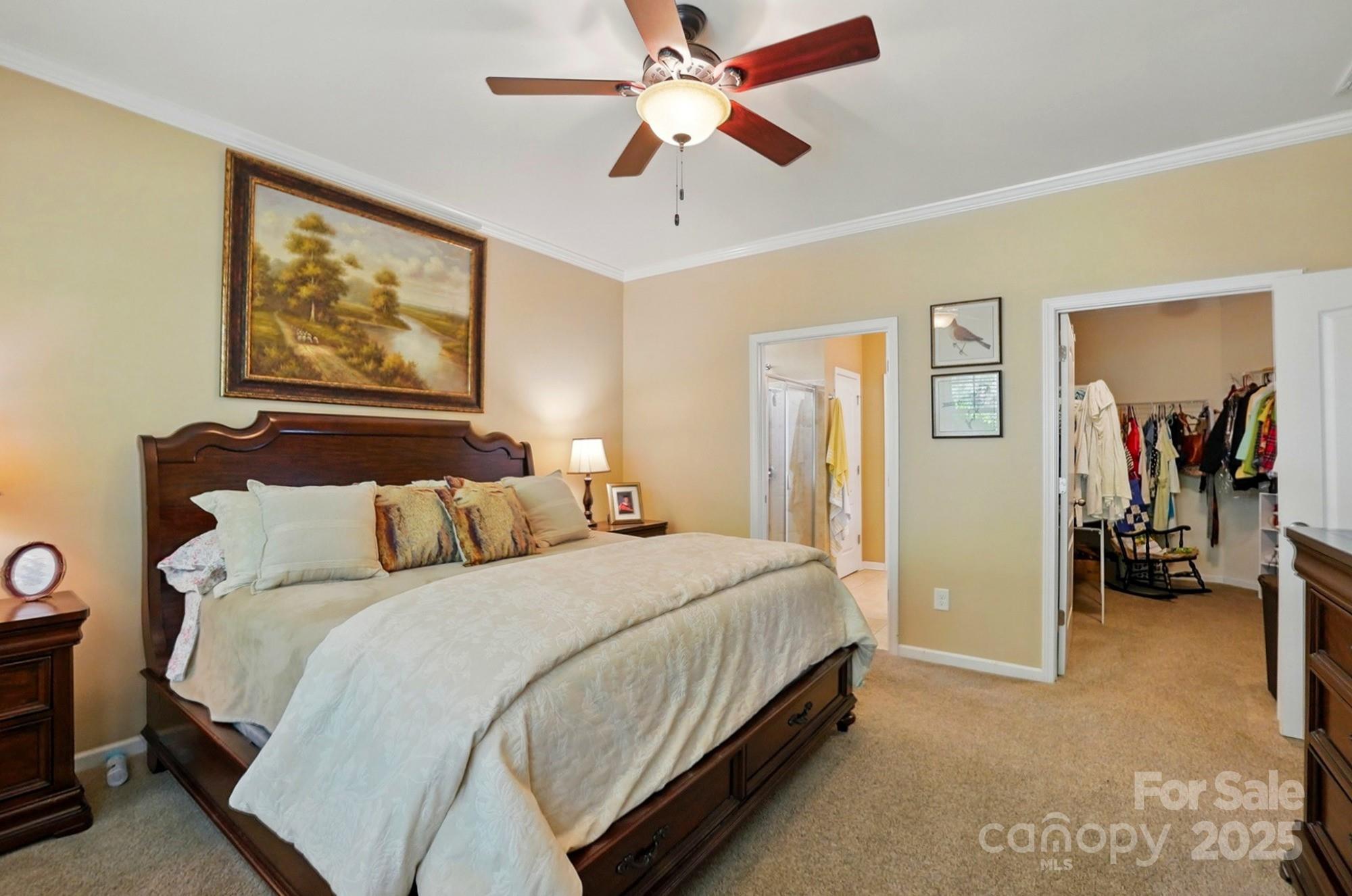 4093 Perth Road Fort Mill, SC 29707 - Photo 16 of 26 a bedroom with a bed and a chandelier