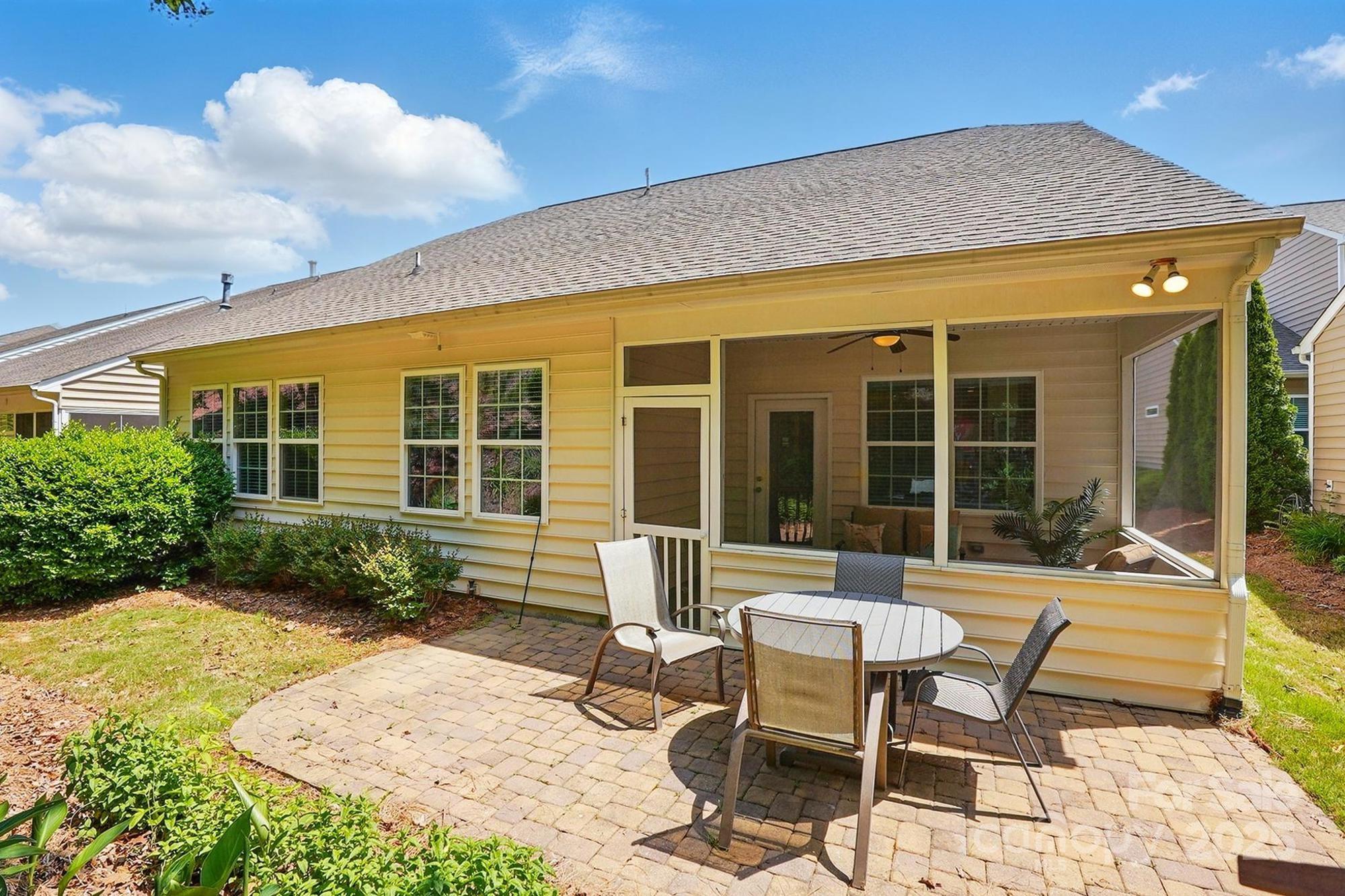 4093 Perth Road Fort Mill, SC 29707 - Photo 26 of 26 a view of a house with backyard sitting area and garden