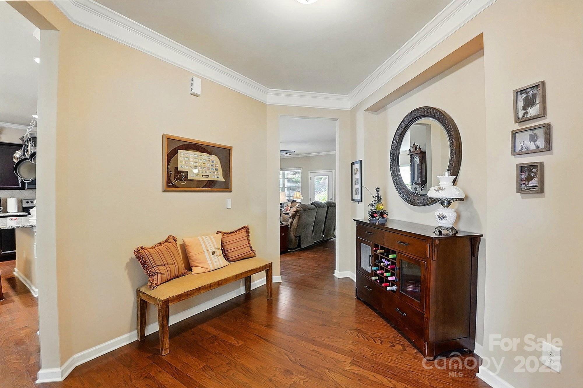 4093 Perth Road Fort Mill, SC 29707 - Photo 4 of 26 a living room with furniture a couch and paintings on the wall
