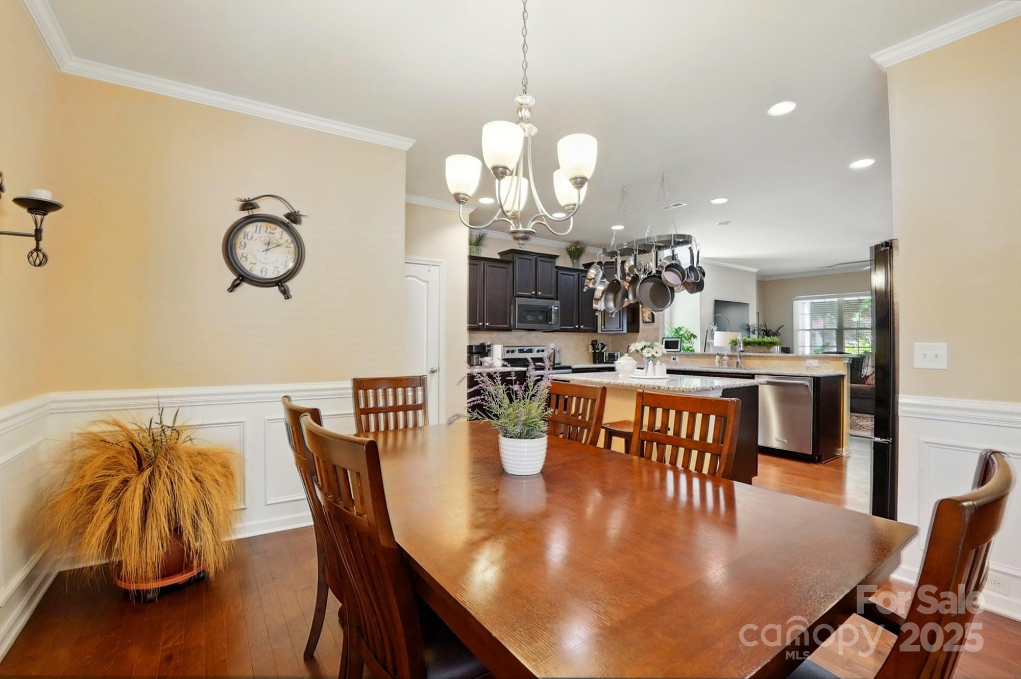 4093 Perth Road Fort Mill, SC 29707 - Photo 6 of 26 a dining room filled chandelier and wooden floor