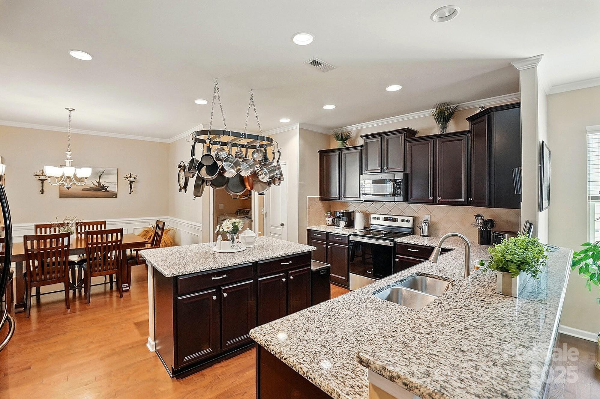 4093 Perth Road Fort Mill, SC 29707 - Photo 7 of 26 a kitchen with a stove a sink and a refrigerator