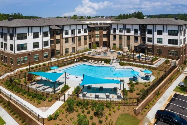 a view of a swimming pool with outdoor seating