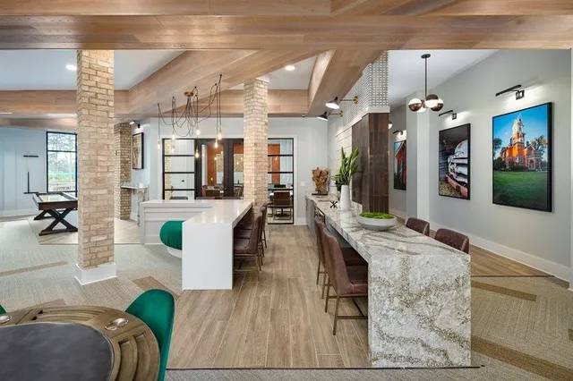 a living room with furniture and flat screen tv