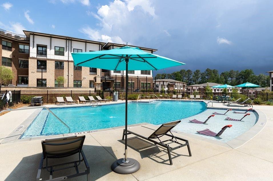 1399 Herrington Road, Unit 9106 Lawrenceville, GA 30044 - Photo 28 of 32 a table and chairs in the patio