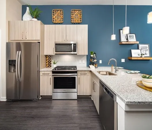 a kitchen with a sink appliances and cabinets