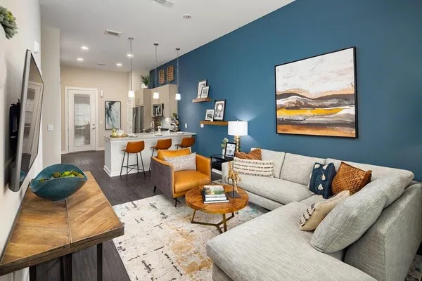 a living room with furniture and a rug