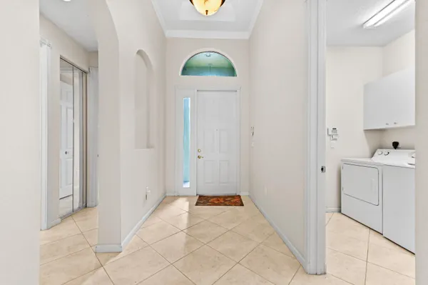 a bathroom with a sink and mirror with vanity