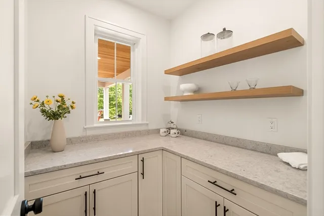 a bathroom with a sink a vanity and a window