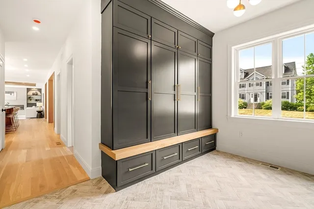 a spacious bathroom with a mirror and shower