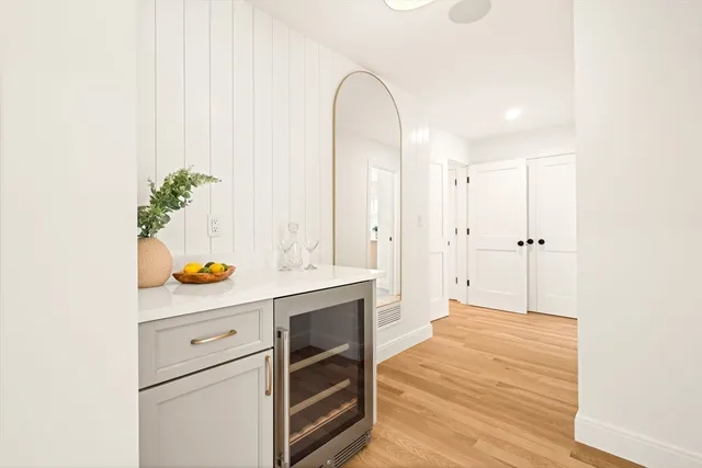 a room with a window and flowerpot