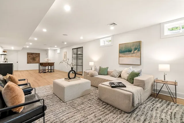 a living room with furniture and a table