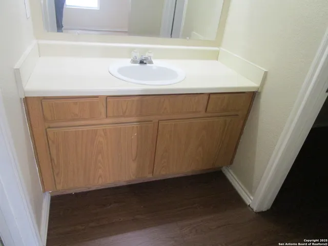 a bathroom with a sink and a mirror