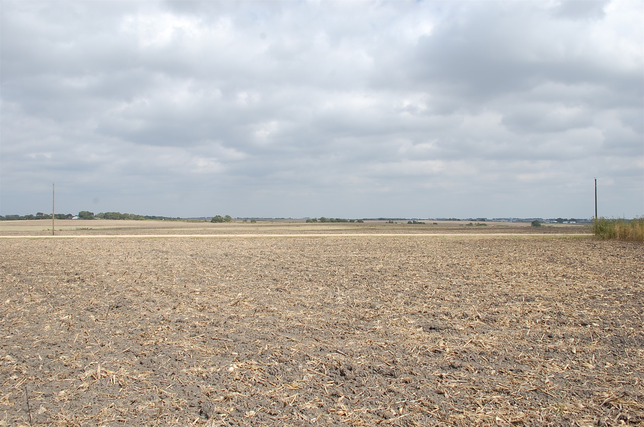 3c Airville Road Temple, TX 76501 - Photo 10 of 12 Wide open rural fields stretch toward the horizon under a soft overcast sky.