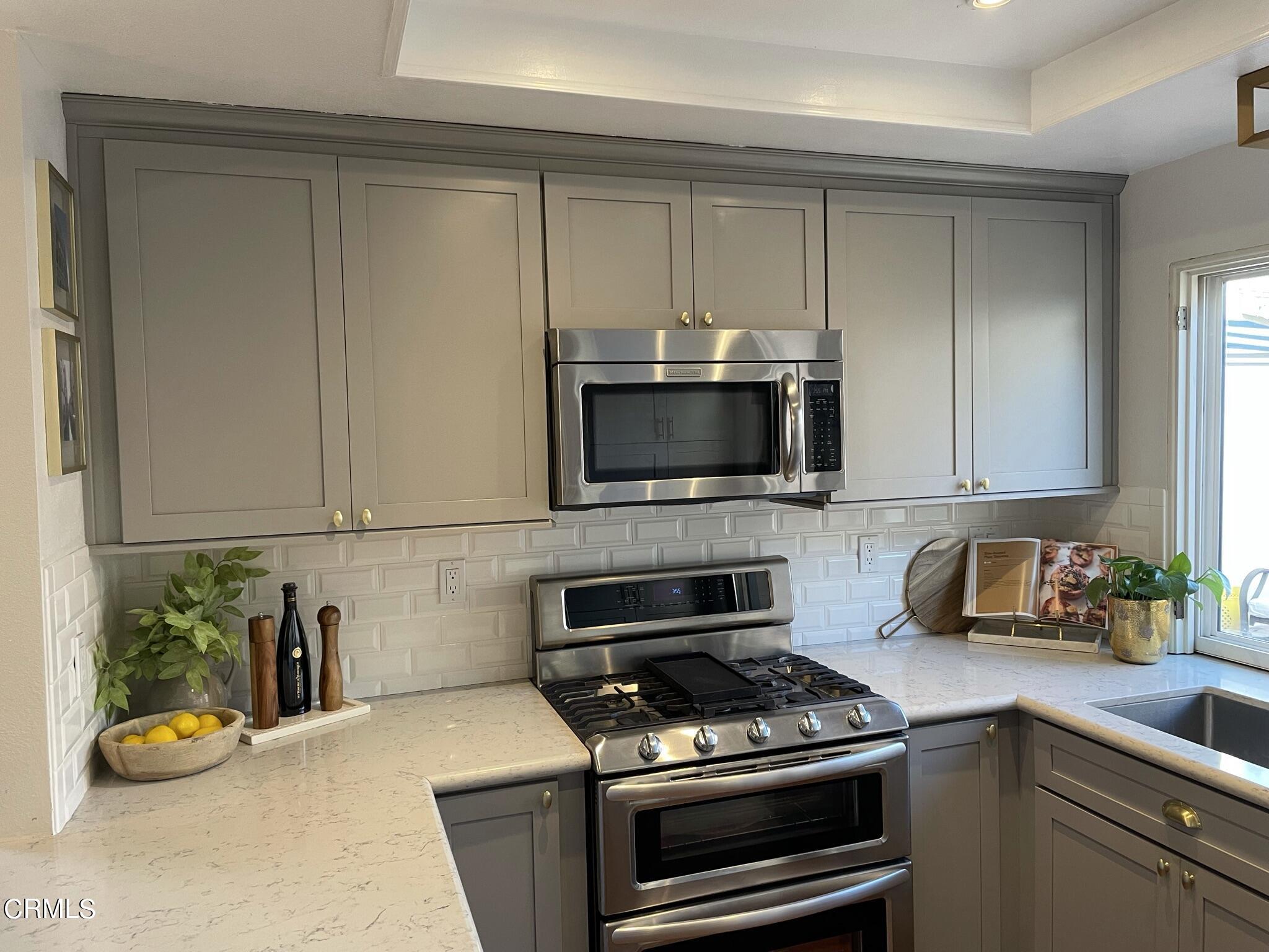 7 Racing Wind Irvine, CA 92614 - Photo 13 of 31 a kitchen with a stove and a microwave