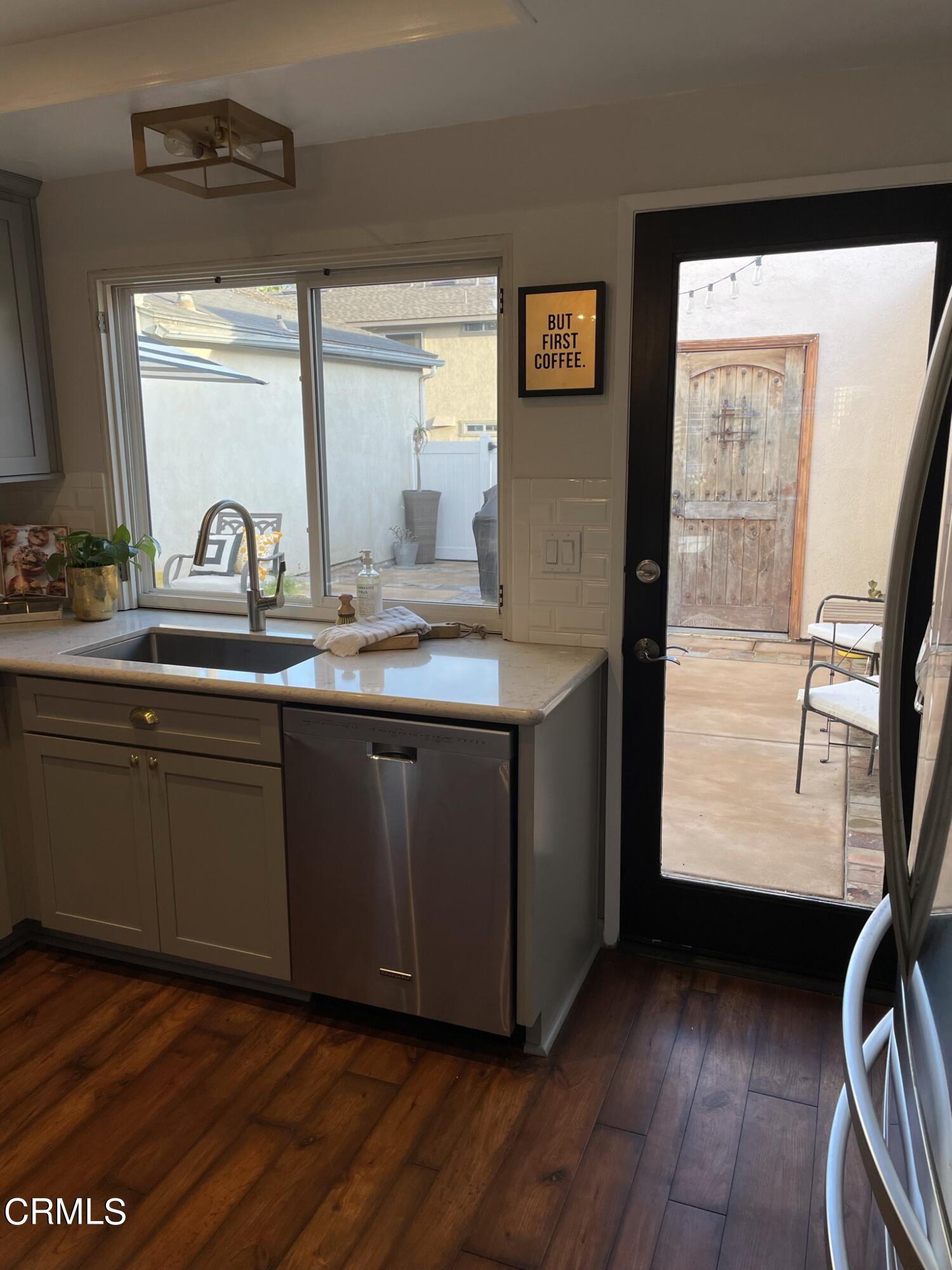 7 Racing Wind Irvine, CA 92614 - Photo 14 of 31 a kitchen with a sink window and cabinets