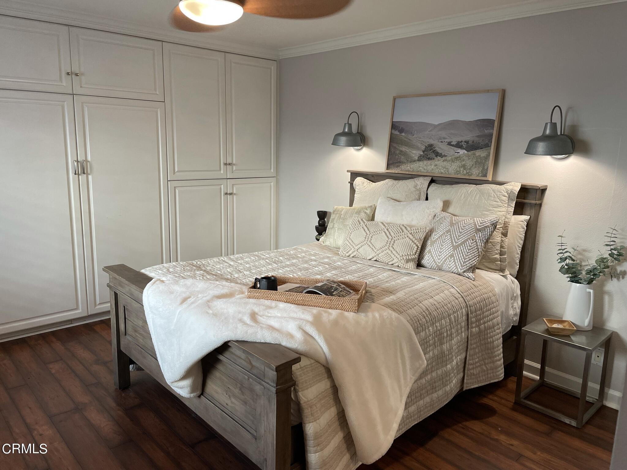 7 Racing Wind Irvine, CA 92614 - Photo 16 of 31 a bedroom with a bed and wooden floor