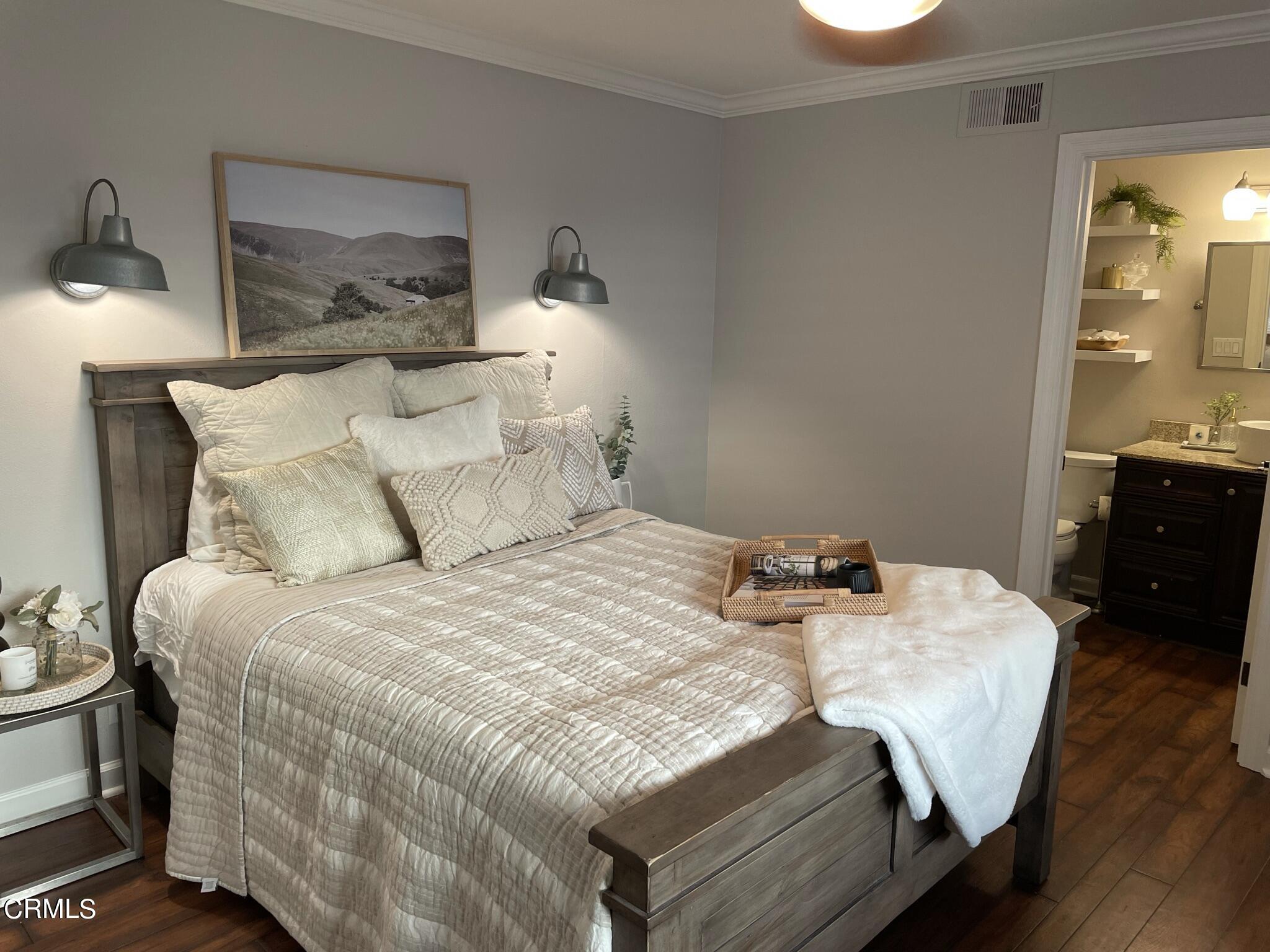 7 Racing Wind Irvine, CA 92614 - Photo 17 of 31 a bedroom with a bed and wooden floor