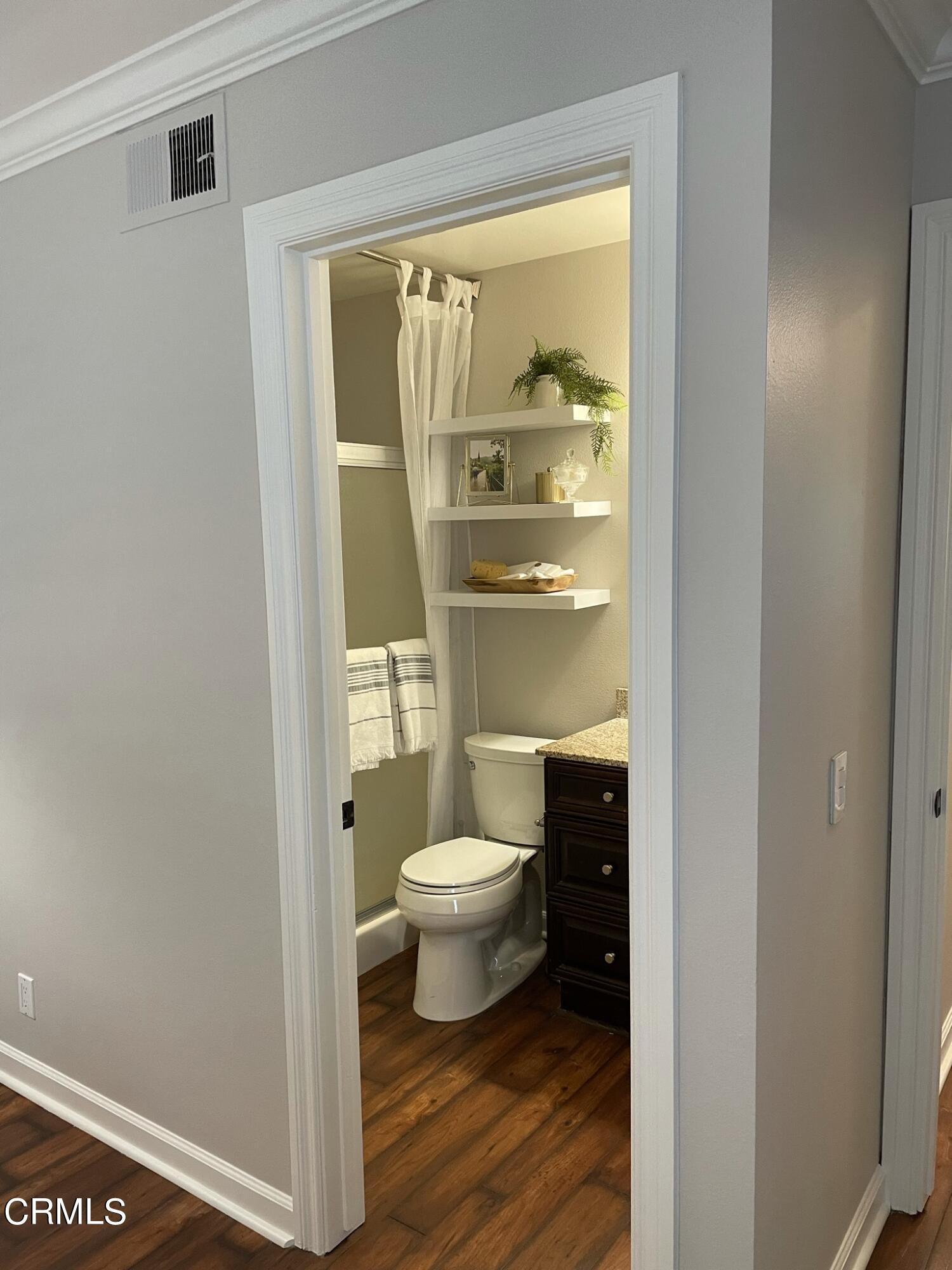 7 Racing Wind Irvine, CA 92614 - Photo 21 of 31 a bathroom with a toilet and a sink