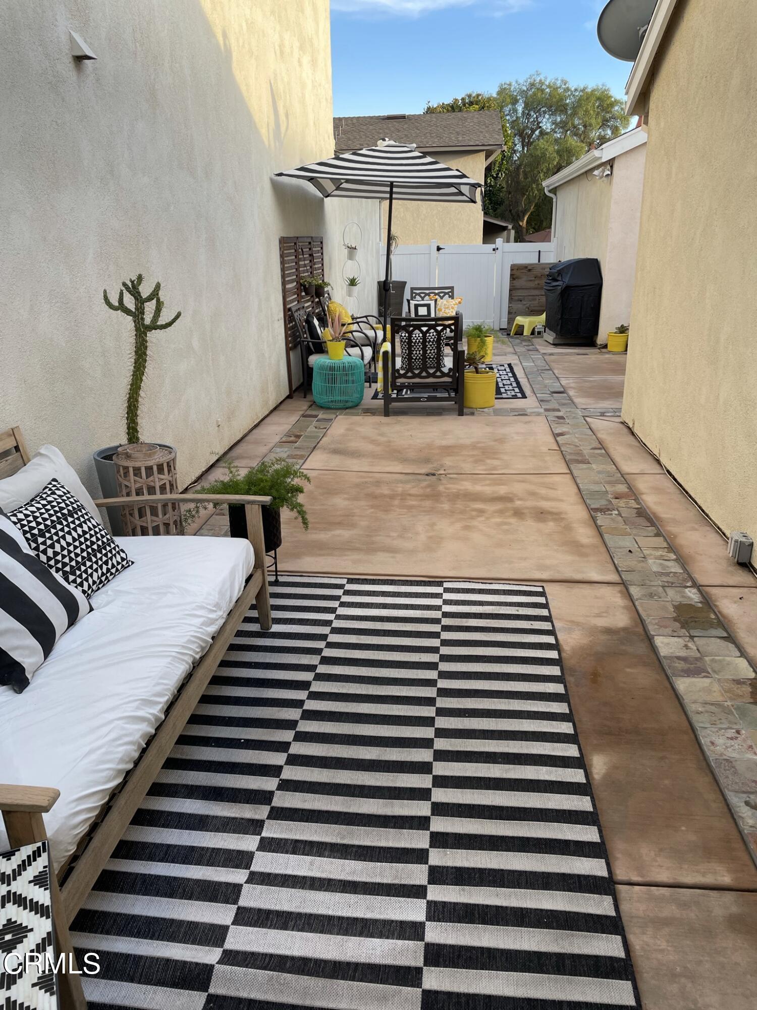 7 Racing Wind Irvine, CA 92614 - Photo 29 of 31 a view of a balcony with chairs and a rug