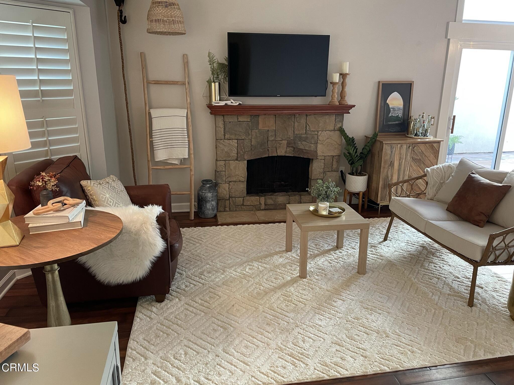 7 Racing Wind Irvine, CA 92614 - Photo 5 of 31 a living room with furniture and a fireplace
