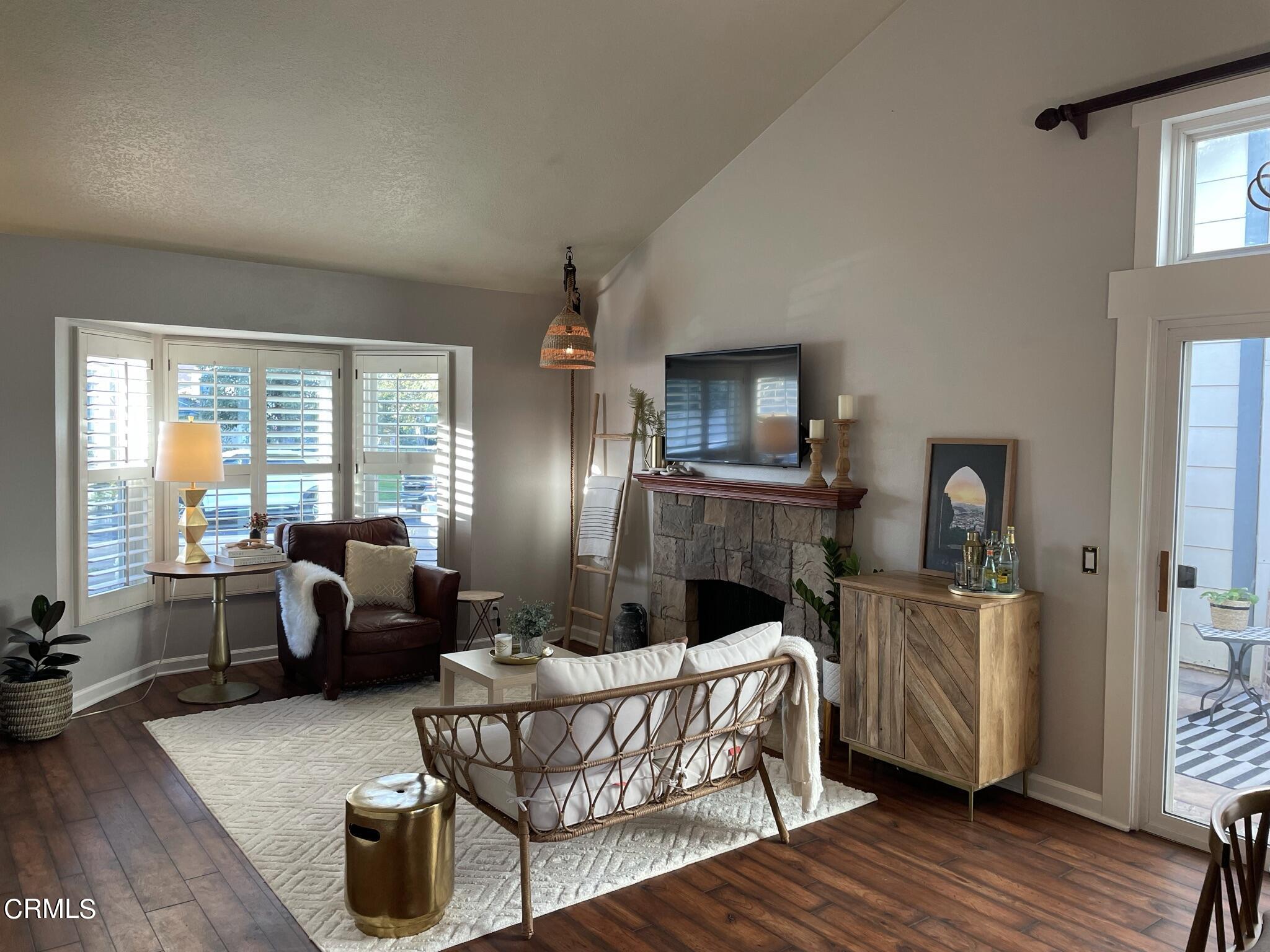 7 Racing Wind Irvine, CA 92614 - Photo 7 of 31 a living room with furniture and a wooden floor