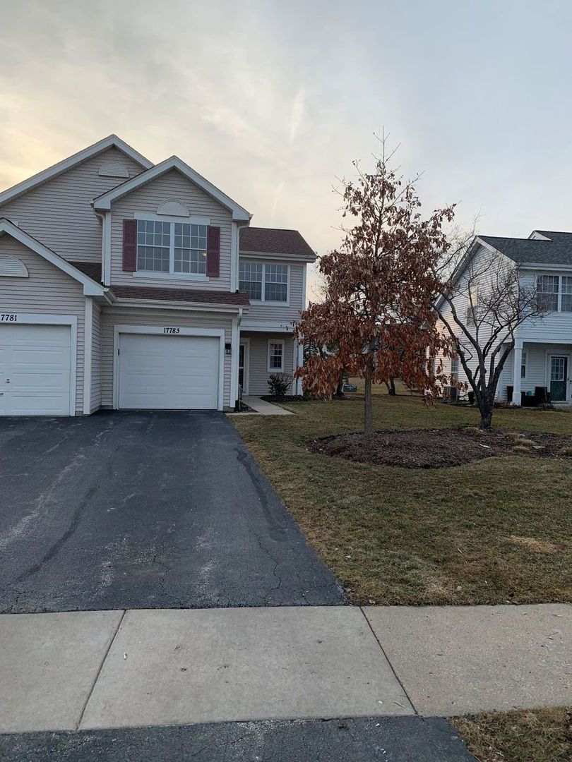 17783 Braewick Road Gurnee, IL 60031 - Photo 1 of 18 a front view of a house with a yard