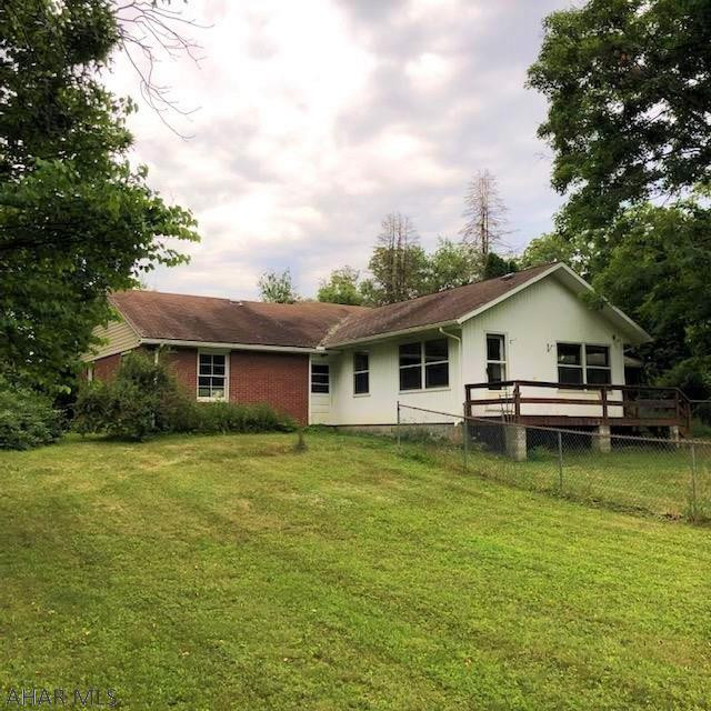 525 Egolf Road Bedford, PA 15522 - Photo 57 of 61 a white house sitting in middle of big green field