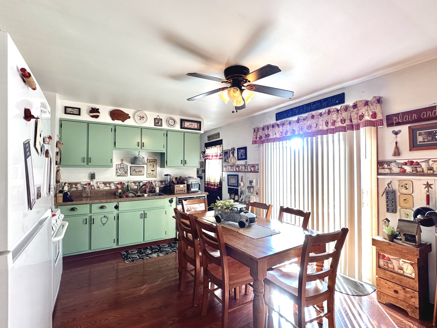 66 Sheffield Road Montgomery, IL 60538 - Photo 14 of 23 a view of a dining room with furniture and a chandelier