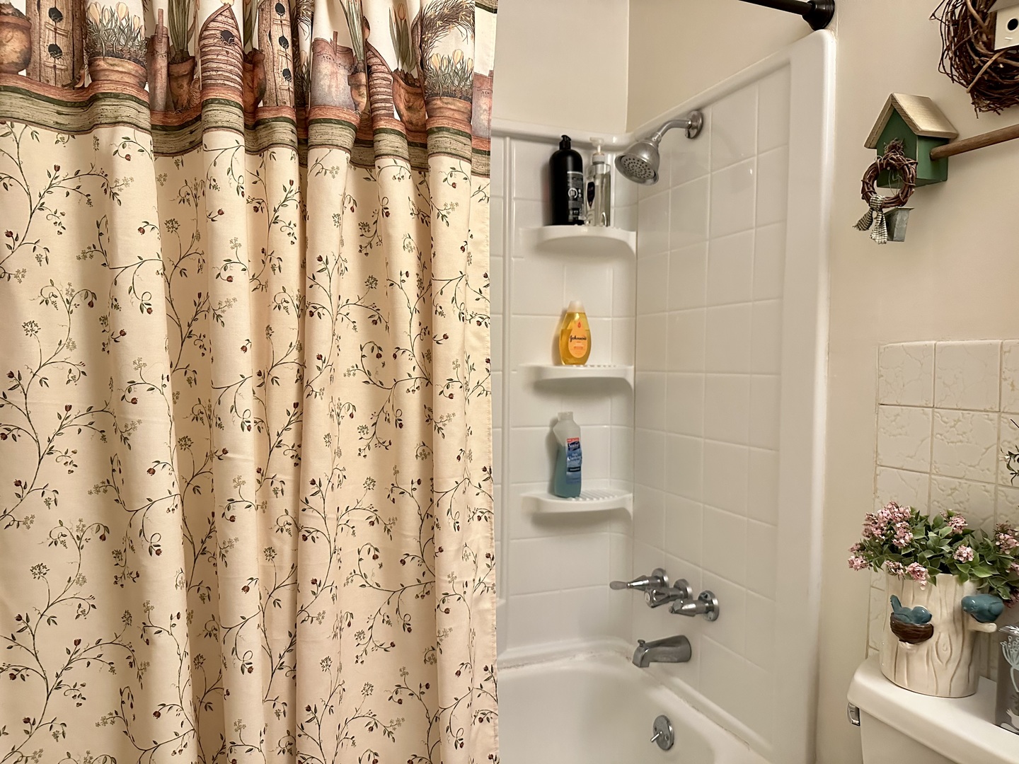 66 Sheffield Road Montgomery, IL 60538 - Photo 18 of 23 a bathroom with a shower curtain and a sink