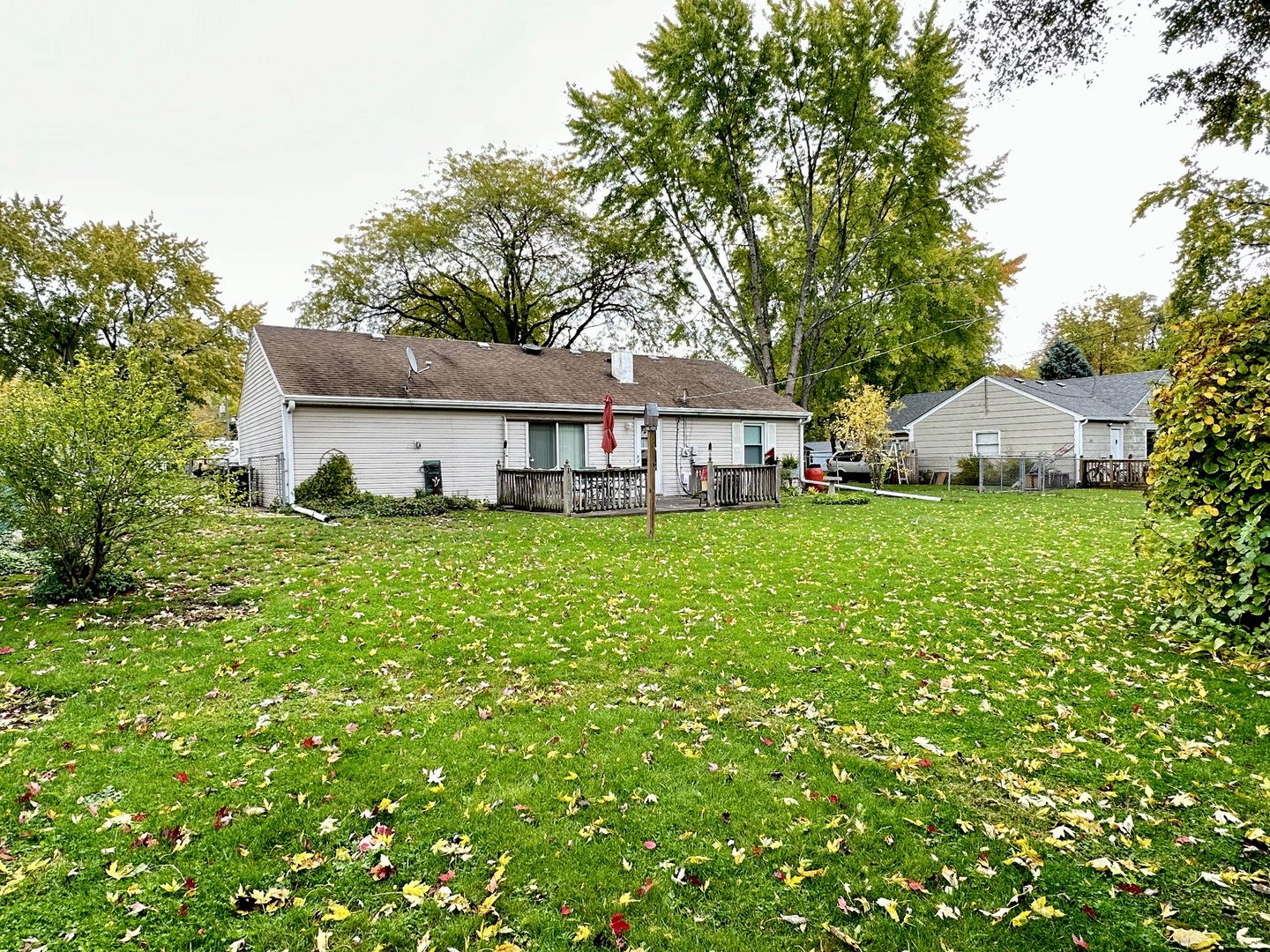 66 Sheffield Road Montgomery, IL 60538 - Photo 4 of 23 a view of a house with a big yard and large trees