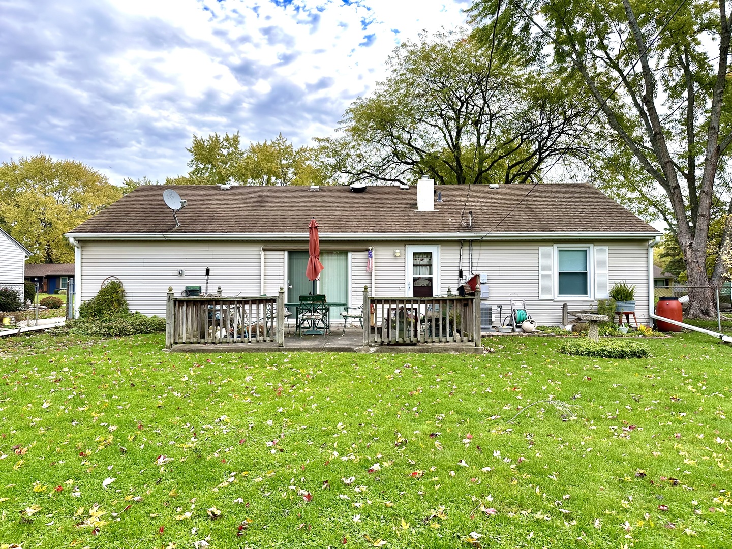 66 Sheffield Road Montgomery, IL 60538 - Photo 7 of 23 a front view of a house with patio and a garden