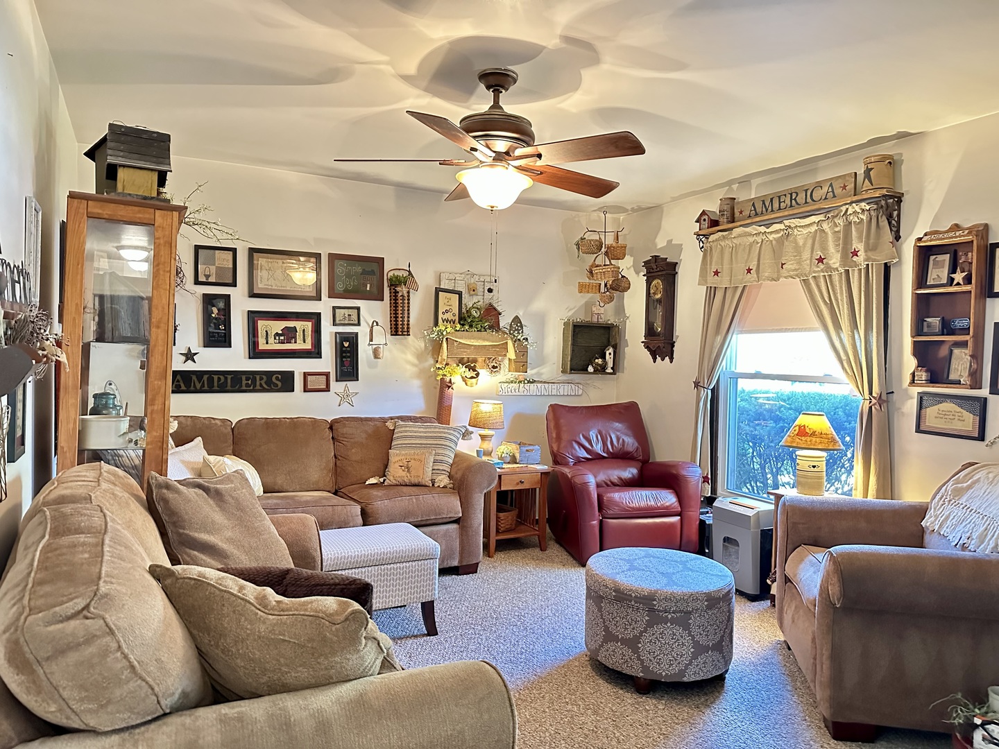 66 Sheffield Road Montgomery, IL 60538 - Photo 10 of 23 a living room with furniture a ceiling fan and a window