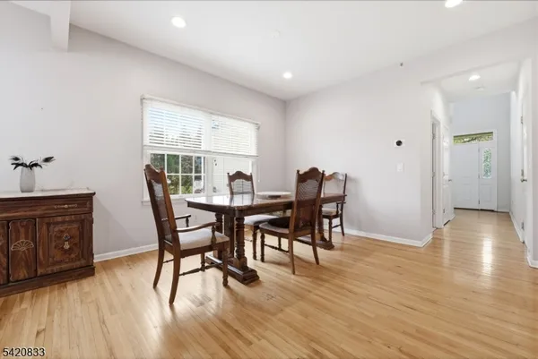 a living room with granite countertop furniture and a chandelier