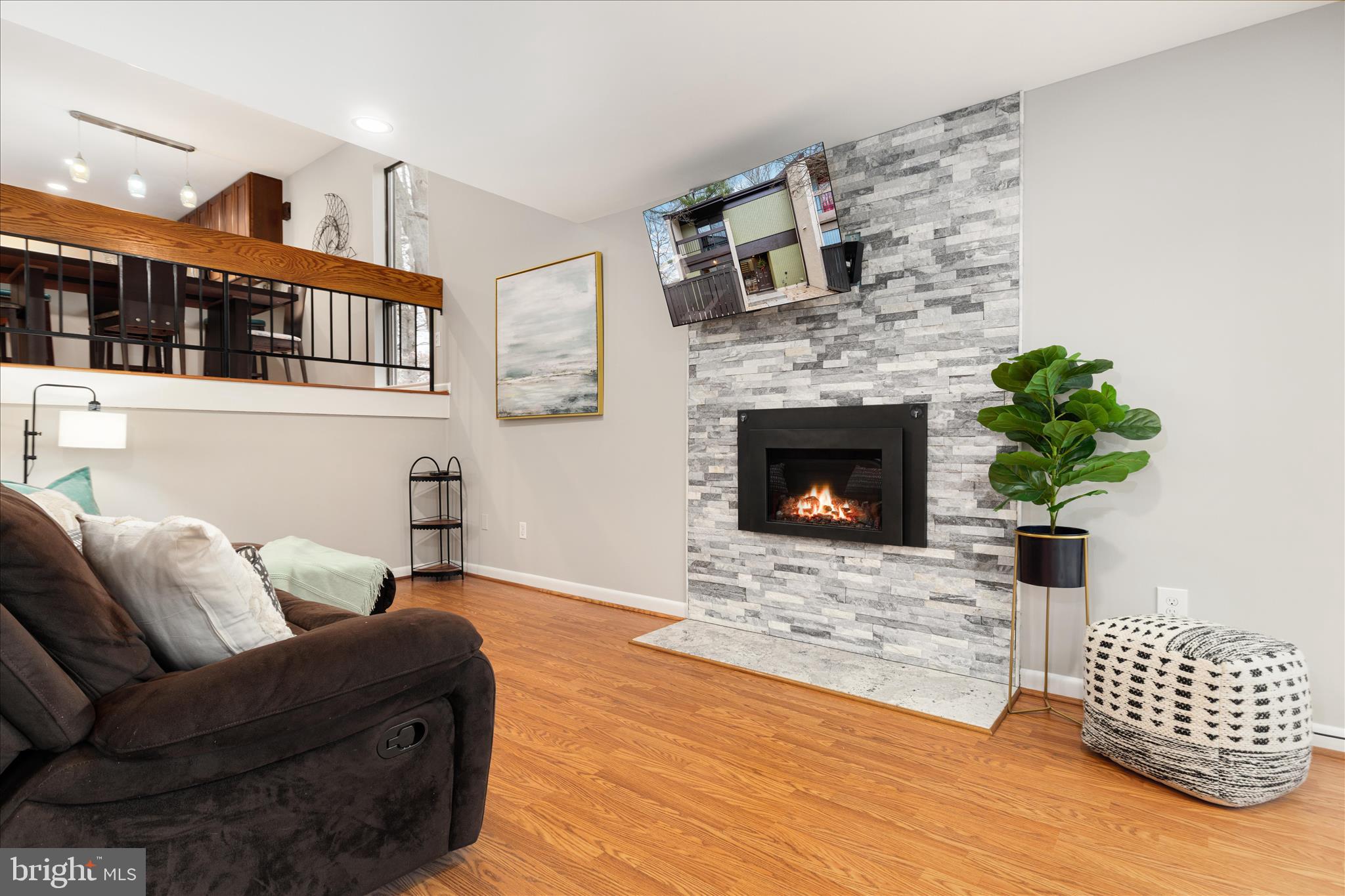 11608 Newbridge Court Reston, VA 20191 - Photo 12 of 47 a living room with furniture and a fireplace