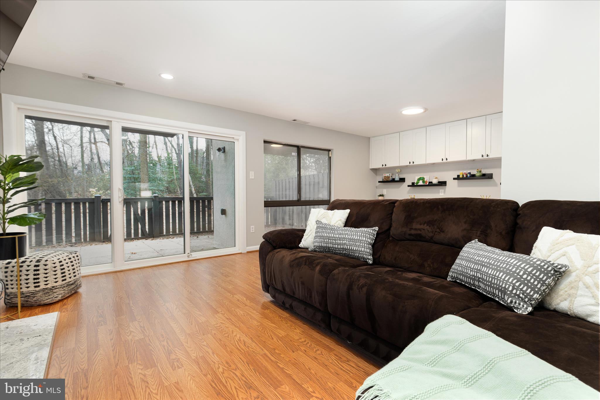 11608 Newbridge Court Reston, VA 20191 - Photo 14 of 47 a living room with furniture and a large window