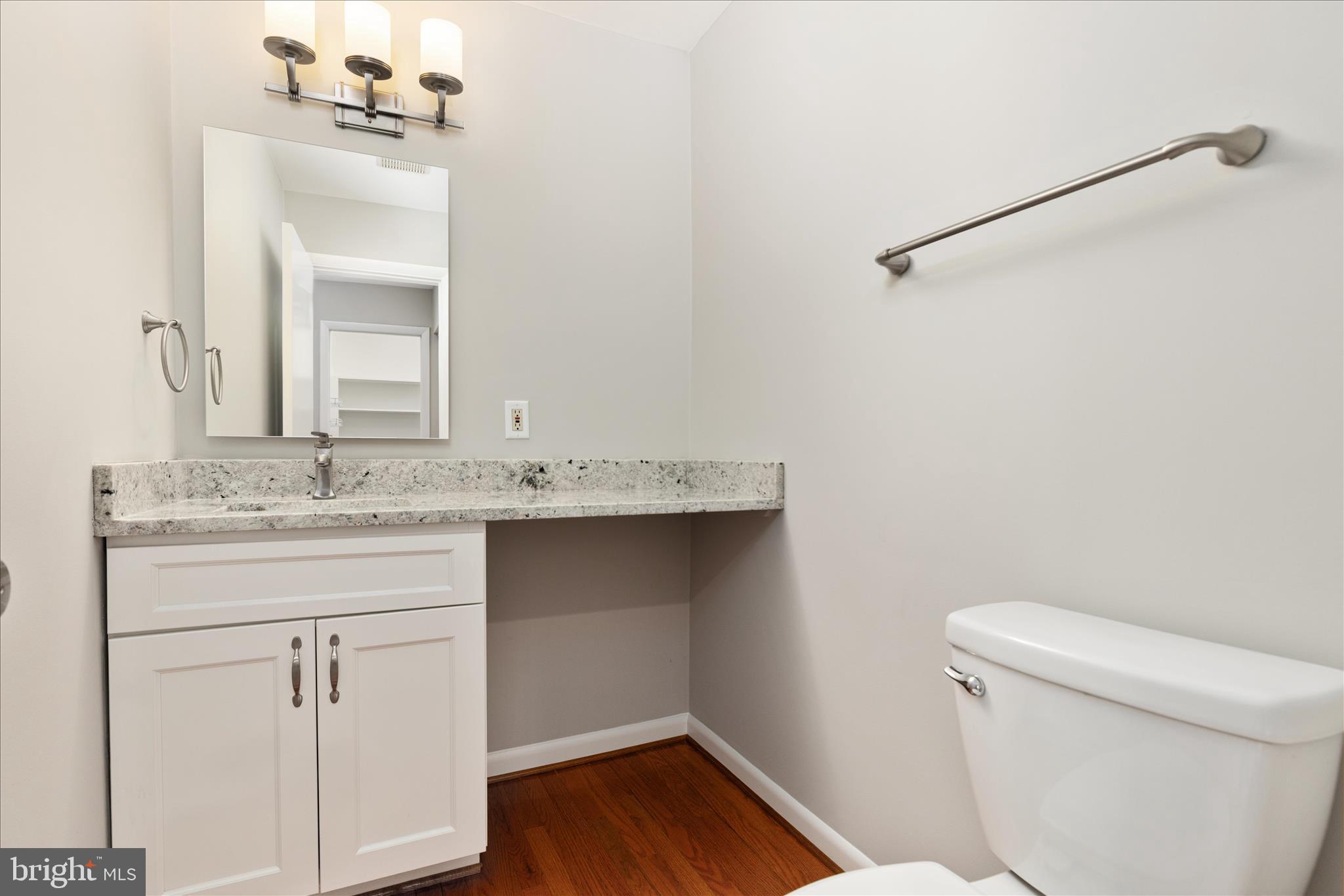 11608 Newbridge Court Reston, VA 20191 - Photo 15 of 47 a bathroom with a sink vanity and a toilet