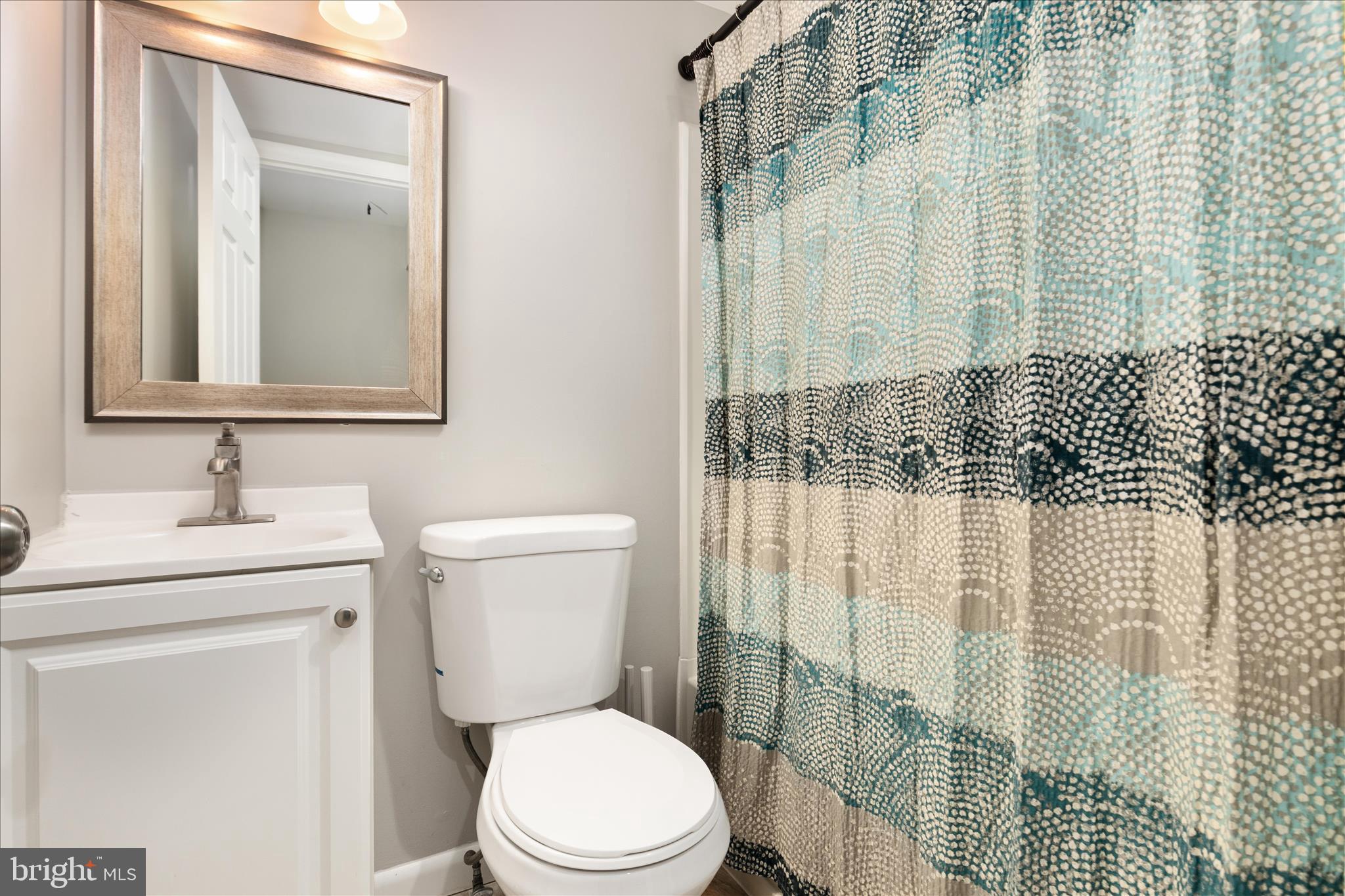 11608 Newbridge Court Reston, VA 20191 - Photo 18 of 47 a bathroom with a toilet a sink and a shower