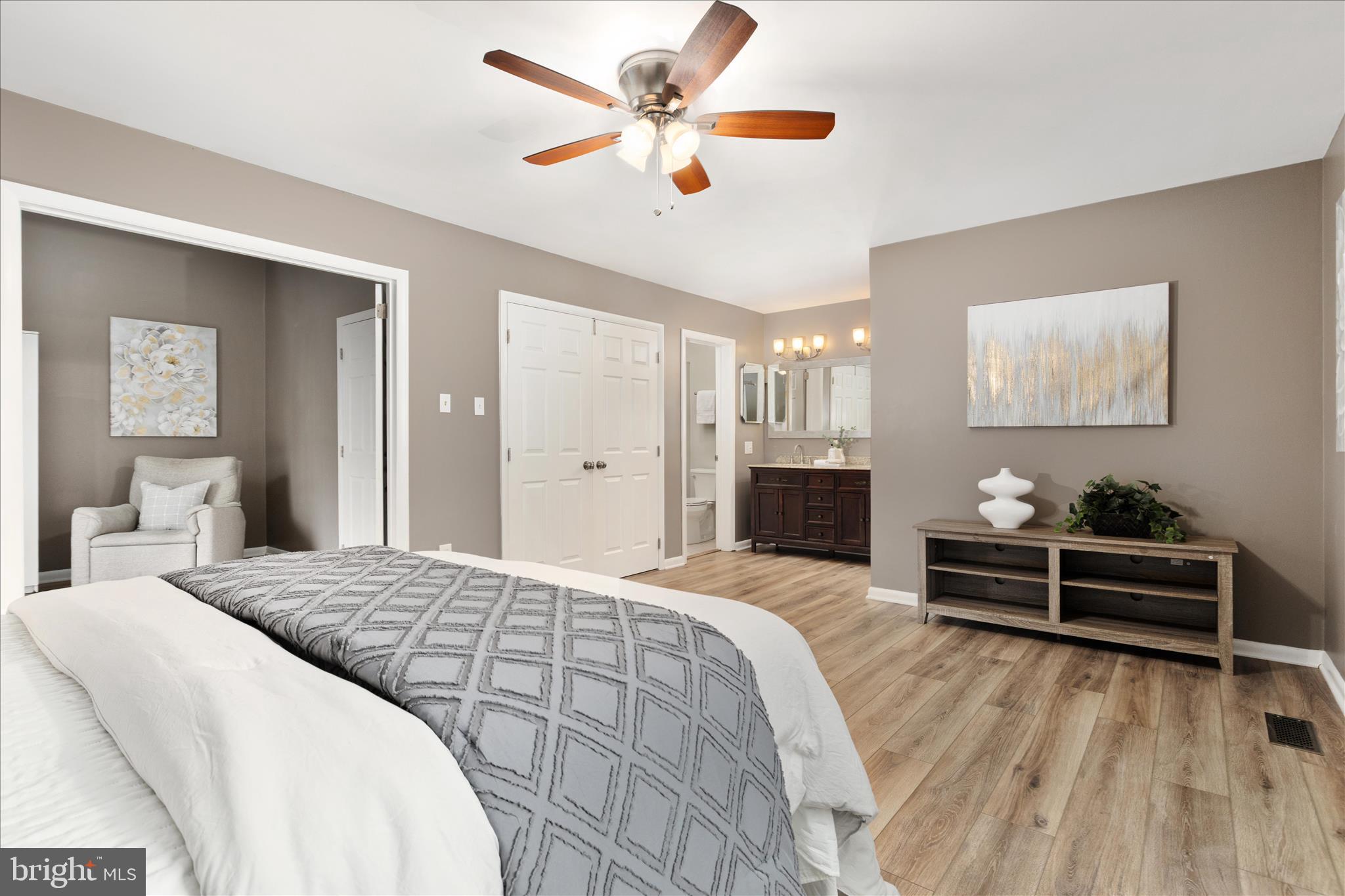 11608 Newbridge Court Reston, VA 20191 - Photo 19 of 47 a bedroom with a bed and a chandelier