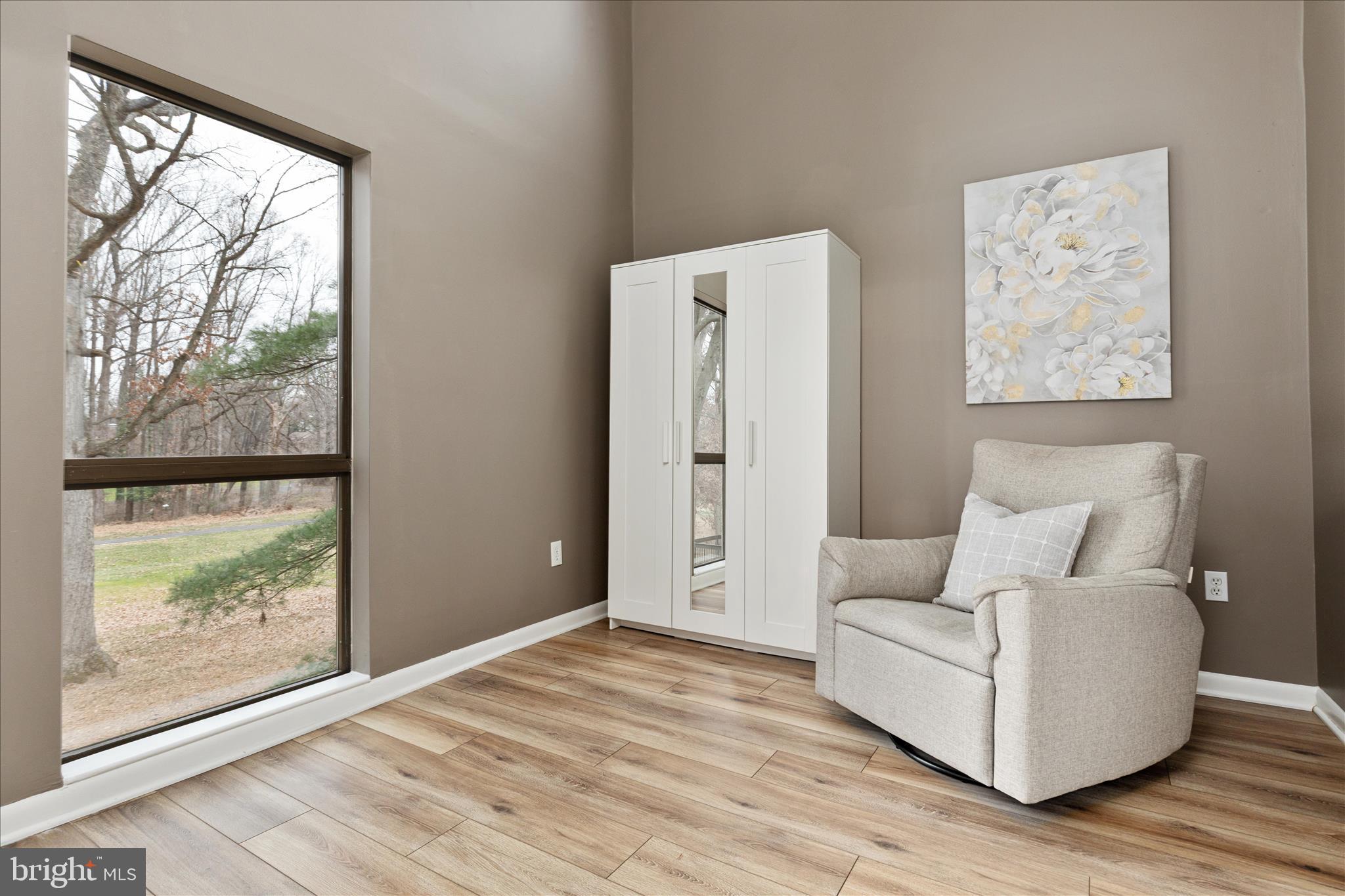 11608 Newbridge Court Reston, VA 20191 - Photo 20 of 47 a living room with furniture and a large window