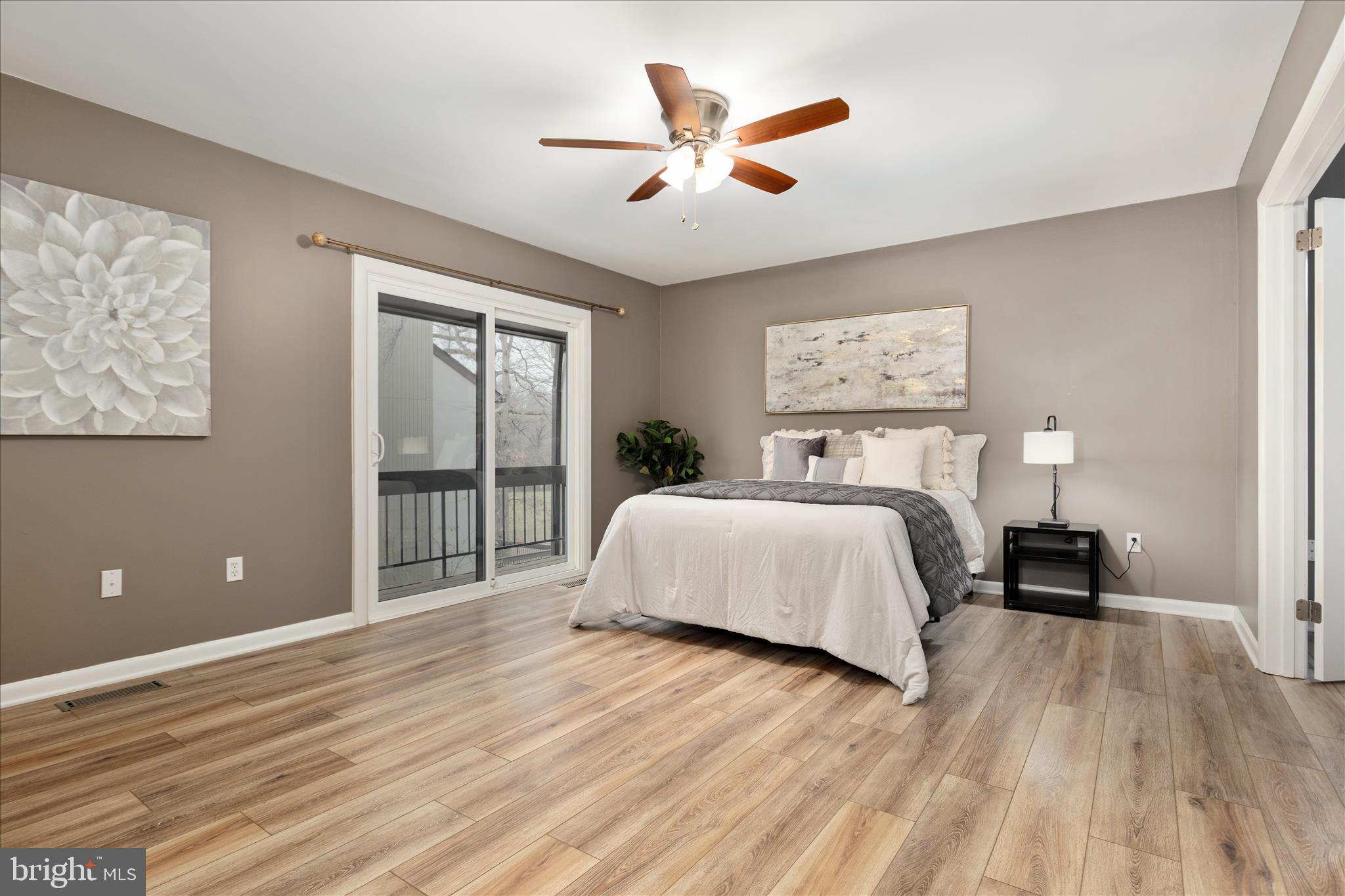 11608 Newbridge Court Reston, VA 20191 - Photo 22 of 47 a bedroom with a large bed and a ceiling fan