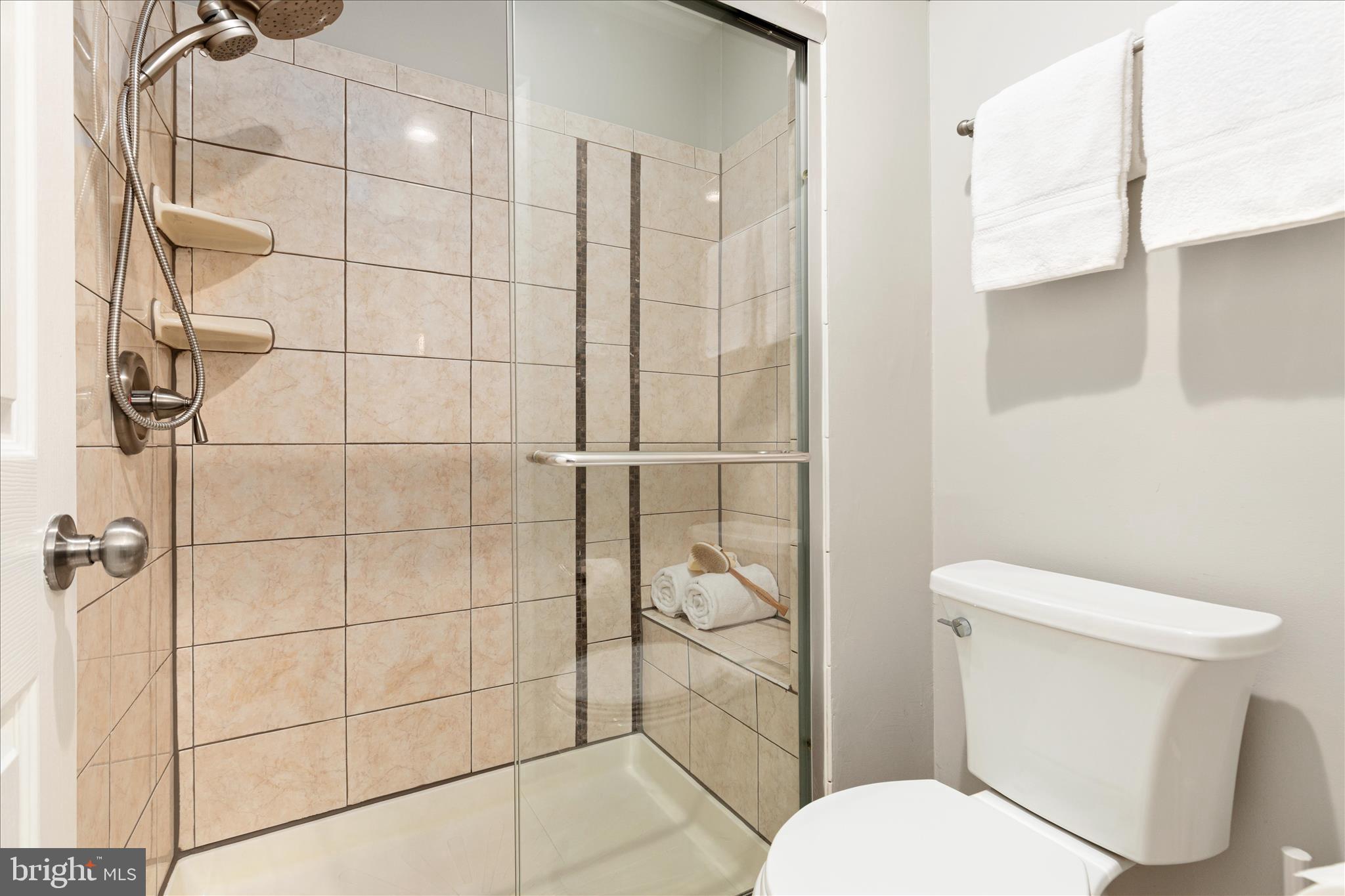 11608 Newbridge Court Reston, VA 20191 - Photo 24 of 47 a white toilet sitting next to a bathroom sink