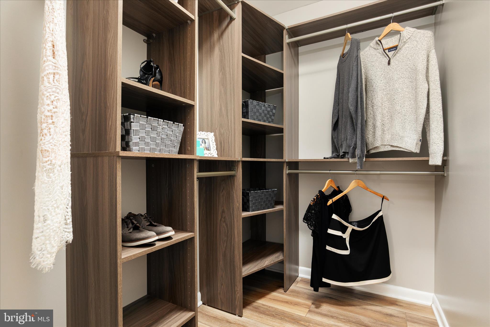 11608 Newbridge Court Reston, VA 20191 - Photo 25 of 47 a view of walk in closet with clothes and shoes