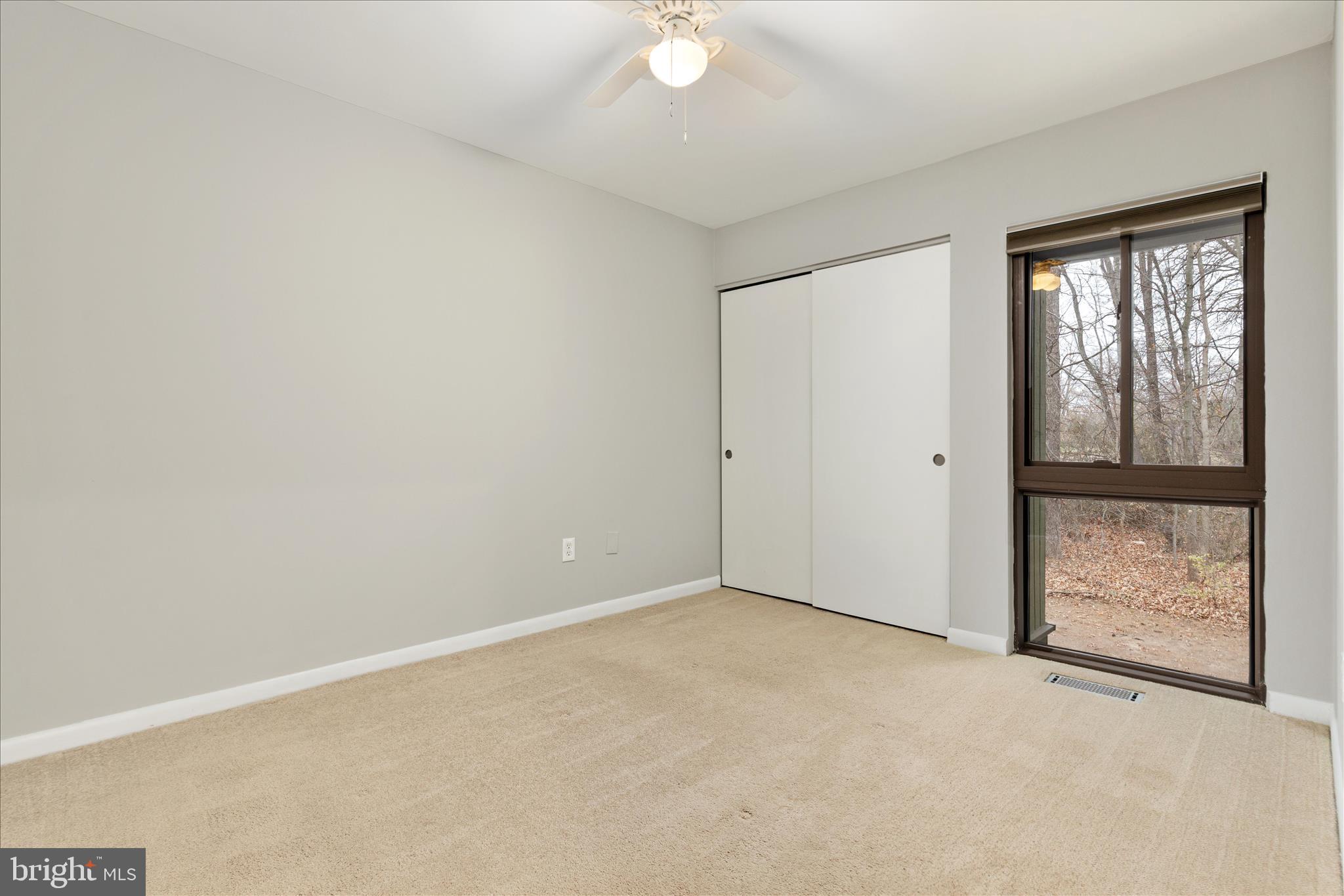 11608 Newbridge Court Reston, VA 20191 - Photo 27 of 47 an empty room with windows and closet