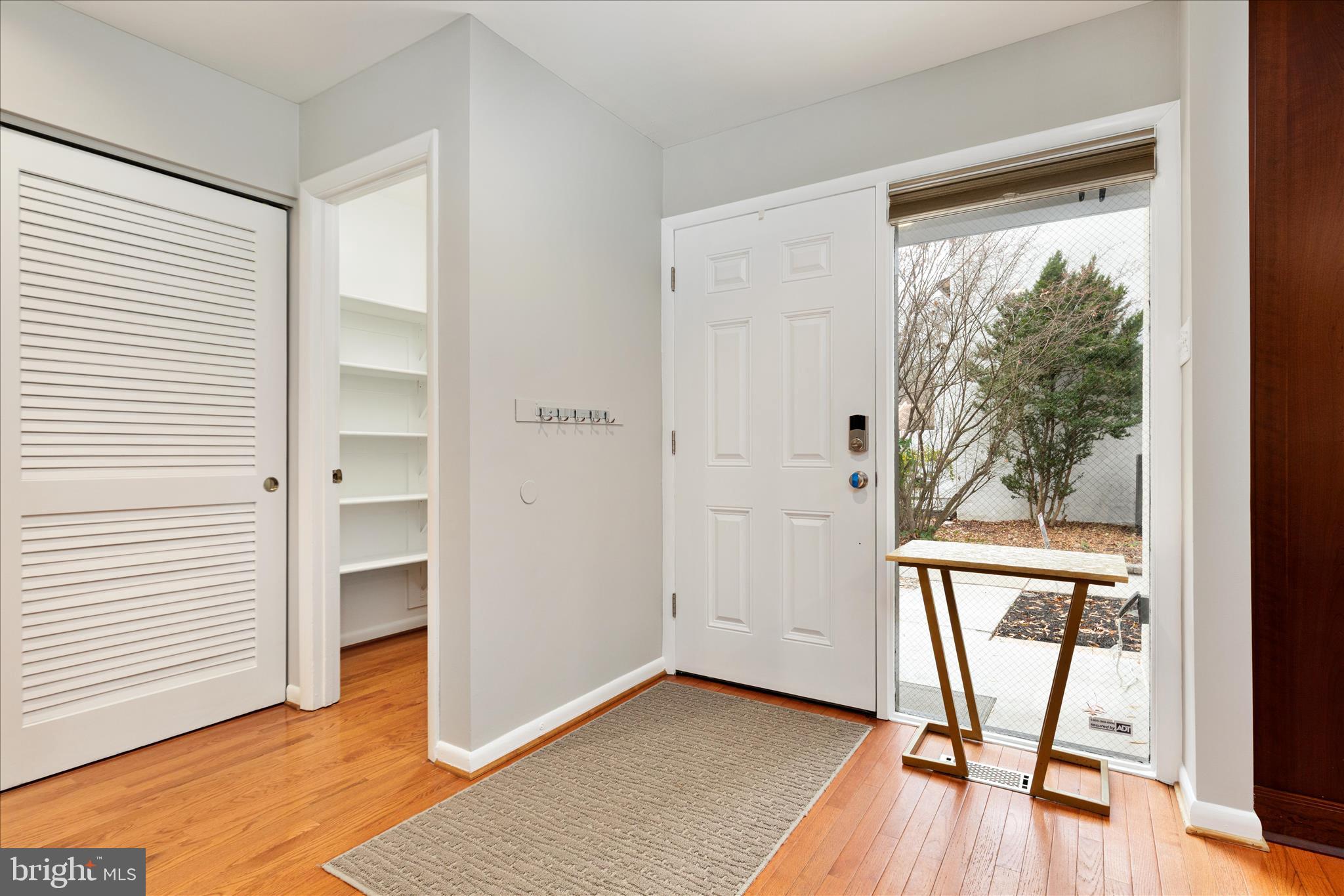 11608 Newbridge Court Reston, VA 20191 - Photo 3 of 47 a view of a room with a large window and wooden floor