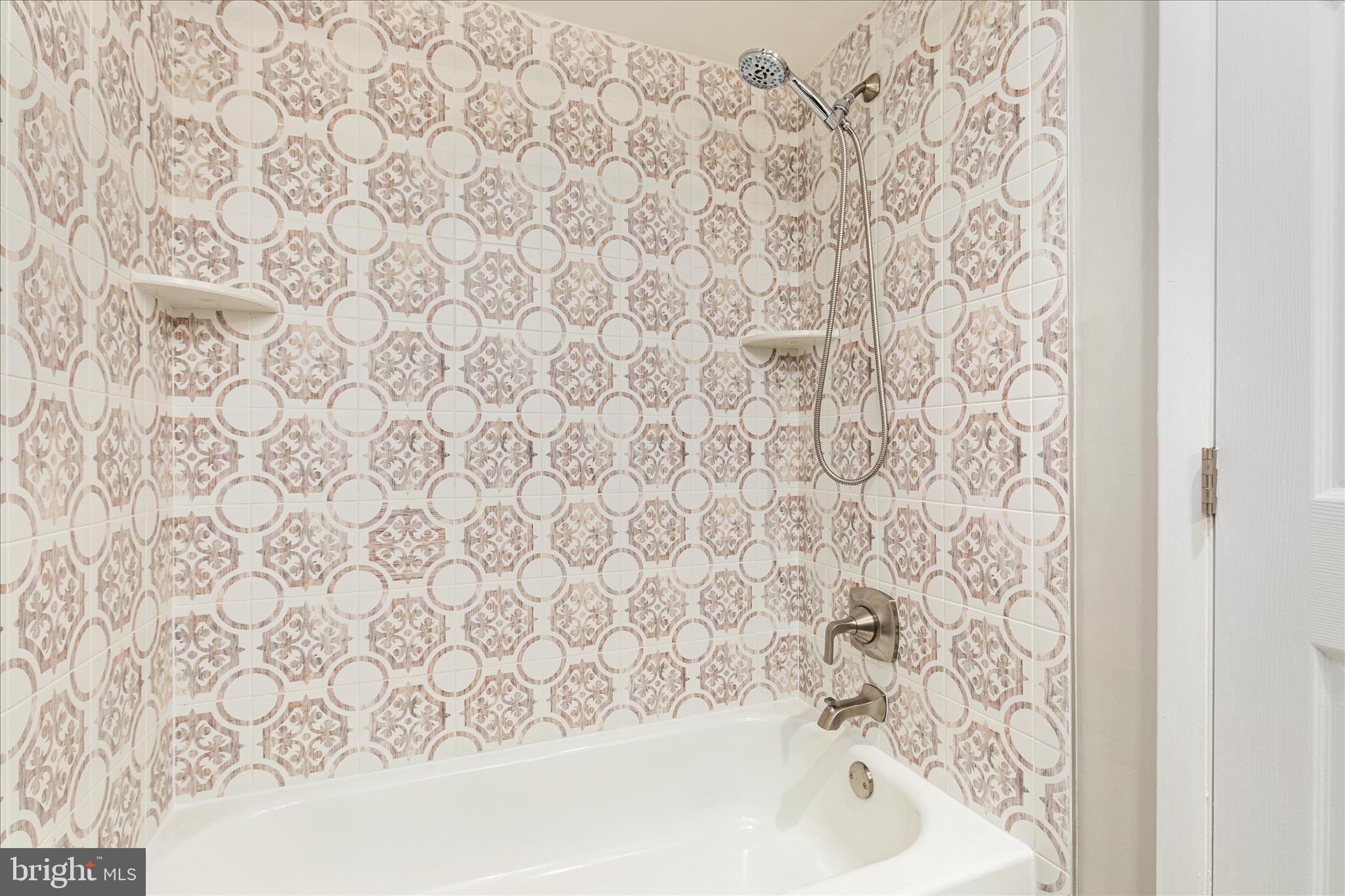 11608 Newbridge Court Reston, VA 20191 - Photo 31 of 47 a bathroom with a bathtub and shower