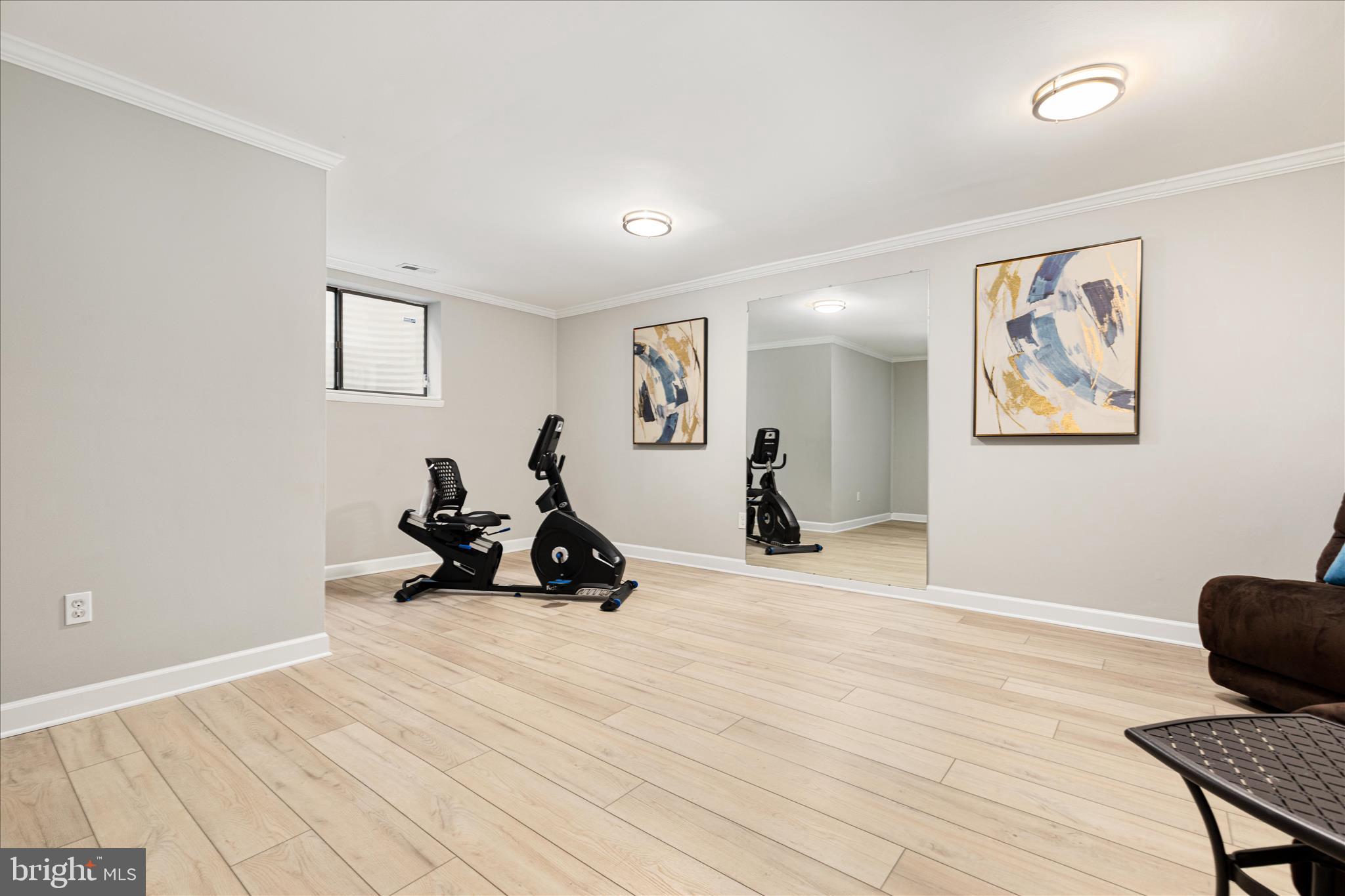 11608 Newbridge Court Reston, VA 20191 - Photo 32 of 47 a room with furniture and a wooden floor