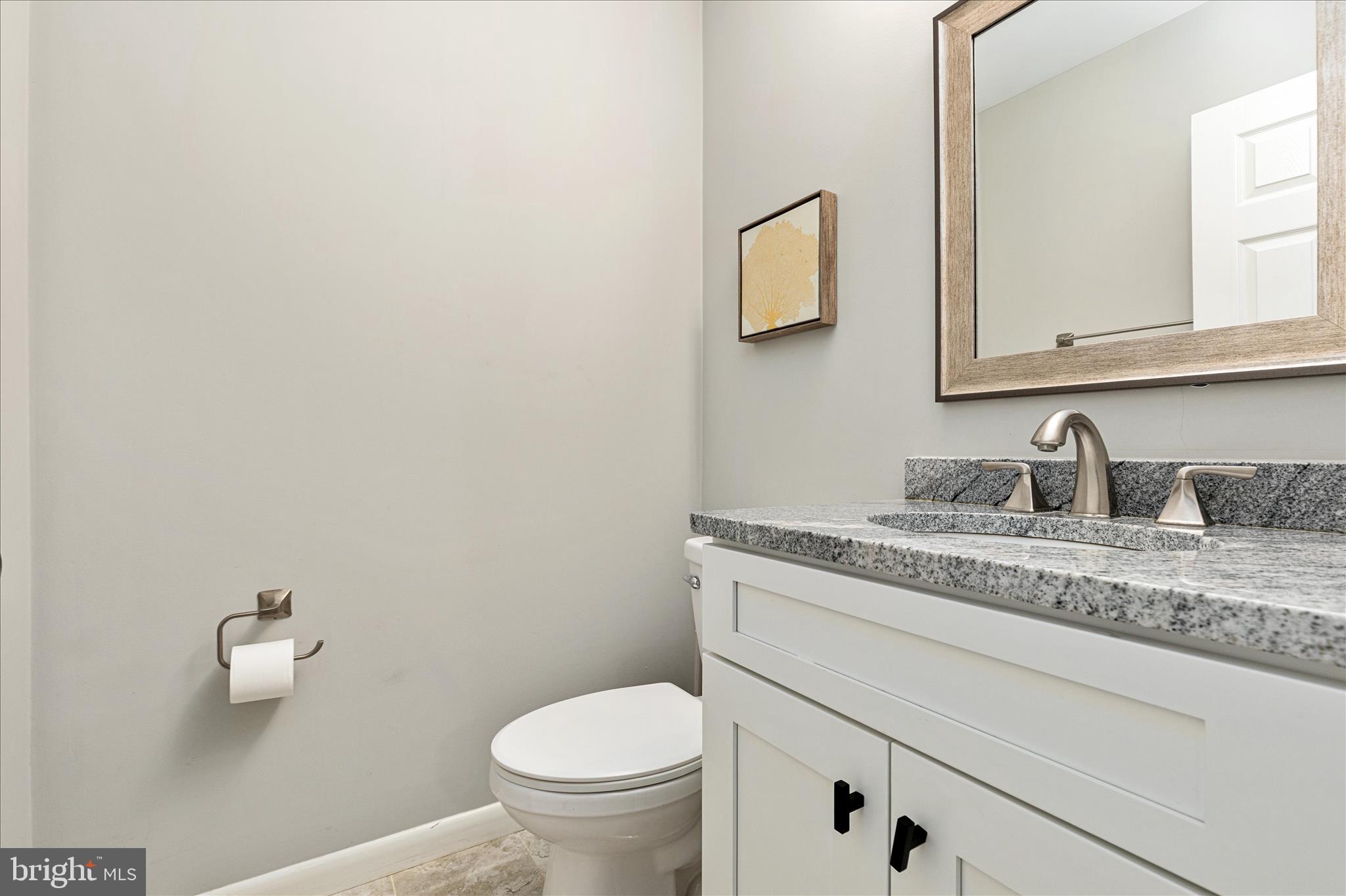 11608 Newbridge Court Reston, VA 20191 - Photo 35 of 47 a bathroom with a granite countertop sink and a toilet