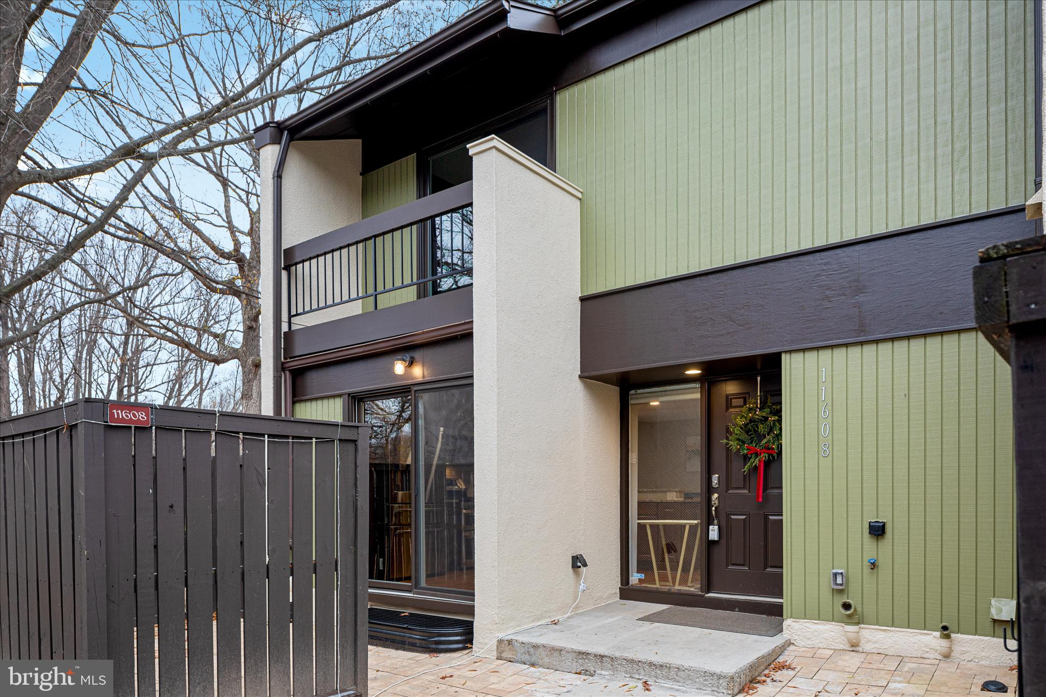 11608 Newbridge Court Reston, VA 20191 - Photo 44 of 47 a view of a house with wooden fence