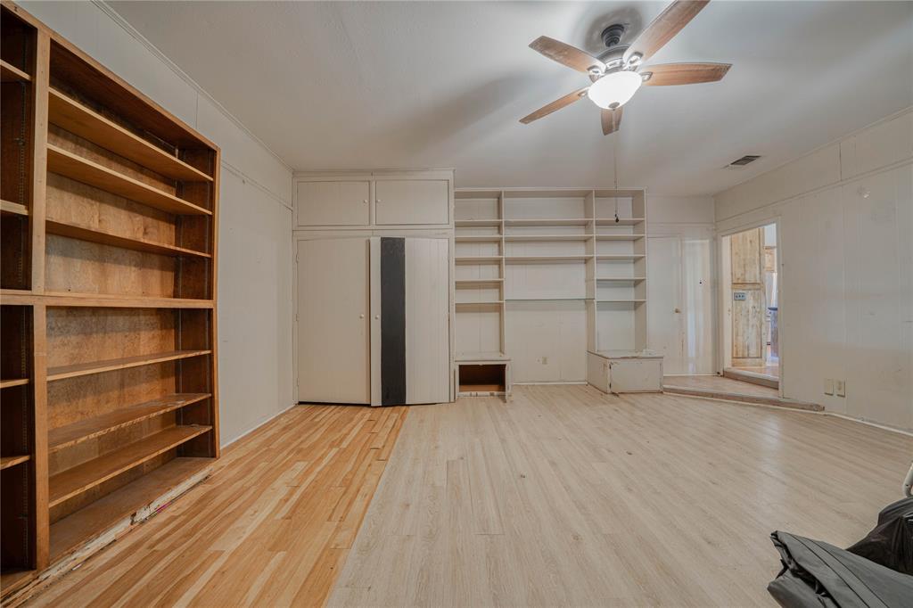 1006 Rikkity Lane Mount Pleasant, TX 75455 - Photo 16 of 39 wooden floor in an empty room with a window